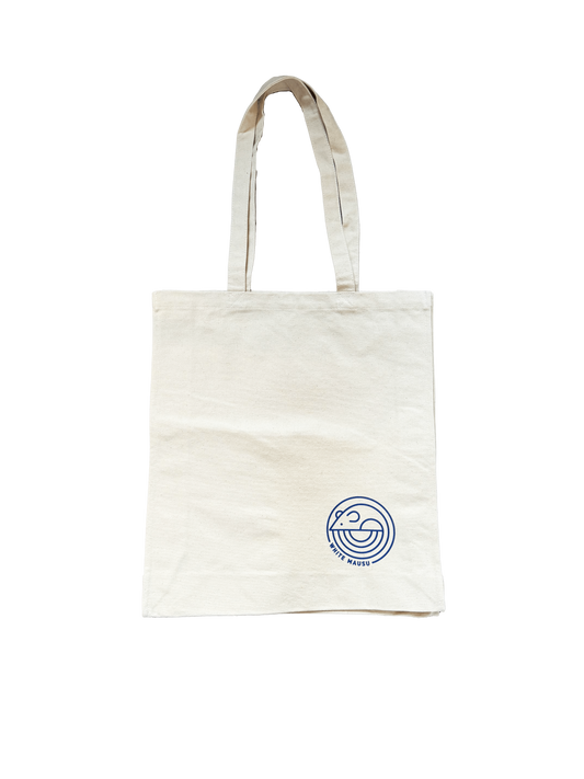 An image of a white cotton tote with the White Mausu logo in blue on the bottom right corner.