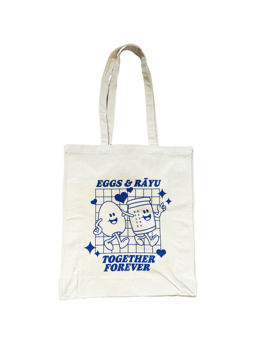 A image of a white cotton tote bag with the 'Eggs and Rāyu Together Forever' image.