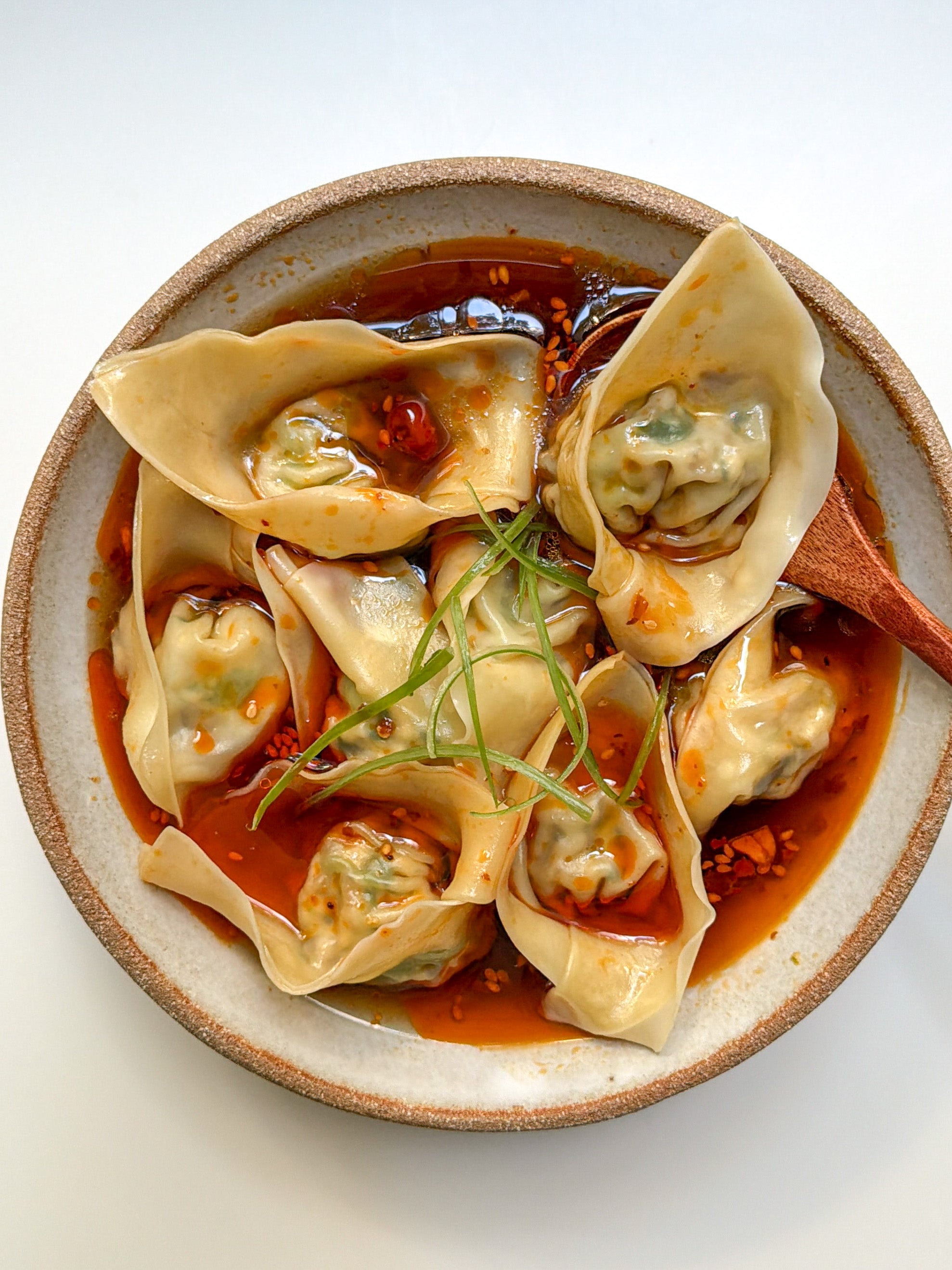 Vegan wontons in spicy and sour broth